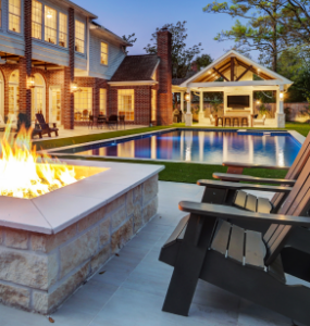 Luxury custom outdoor kitchen and patio with pergola in Houston, designed by Texas Custom Patios.