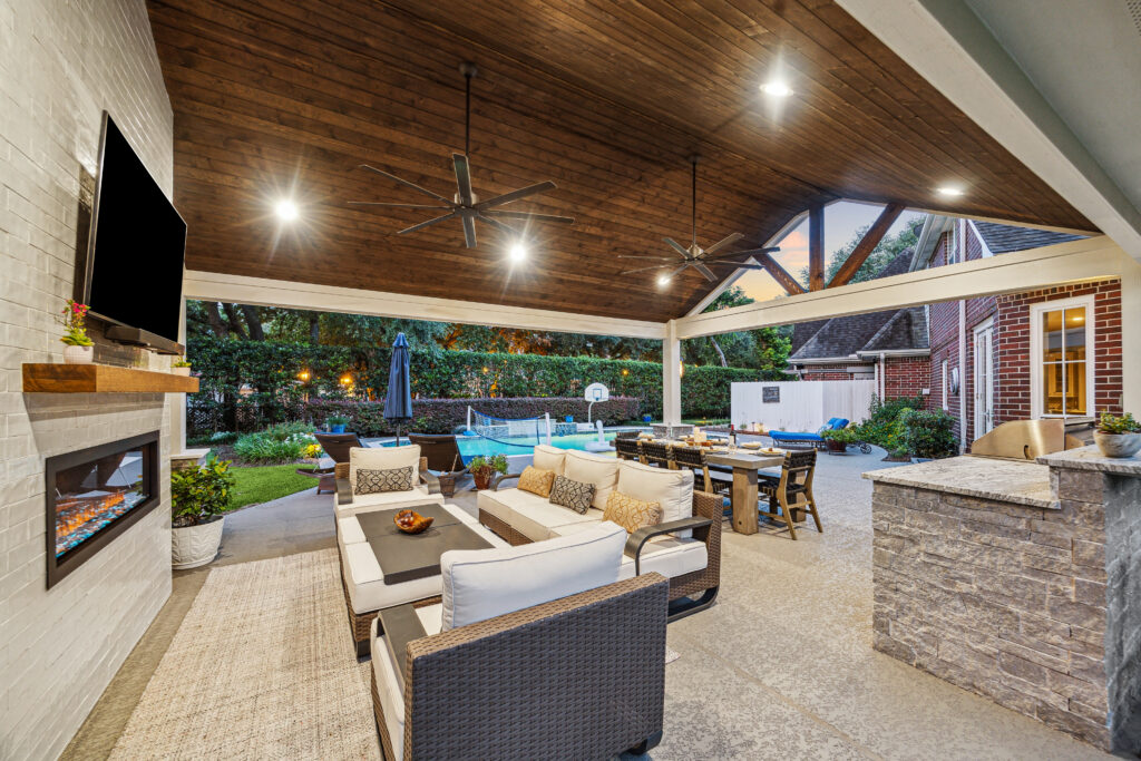 Under the patio cover - outdoor living room with a view of the pool.