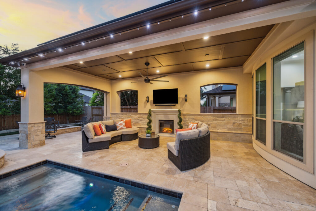 The updated patio cover with an added privacy wall and retractable screens. 