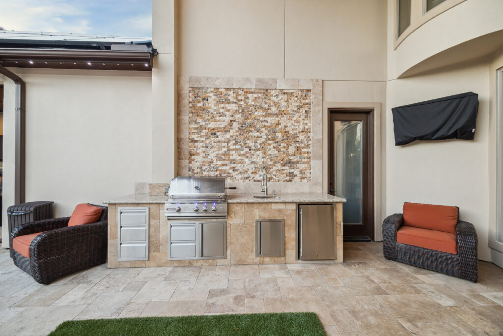  outdoor kitchen area with new appliances.